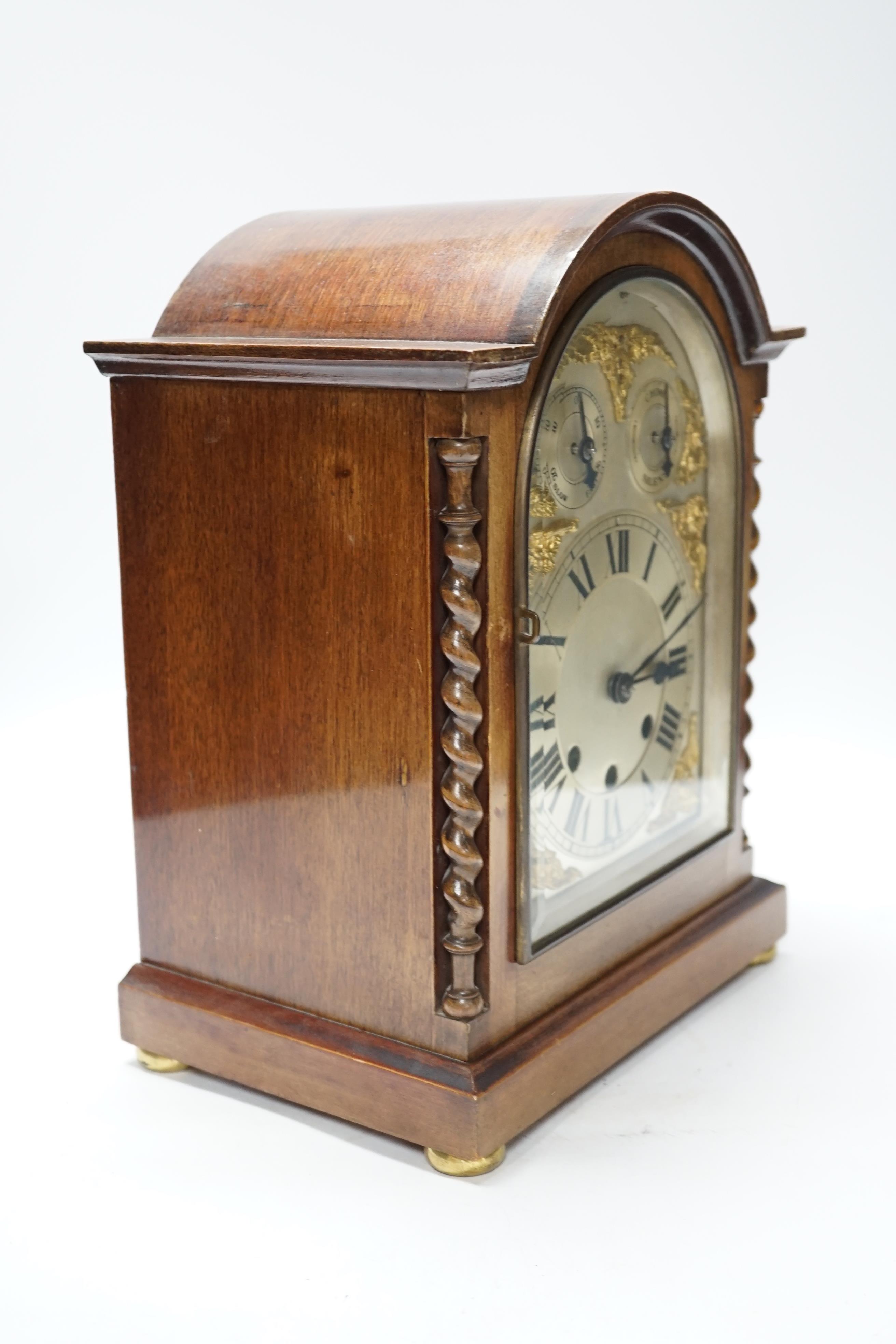 An early 20th century mahogany chiming bracket clock with silvered Roman numeral dial, 34cm high